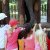Little kids love to feed elephants
